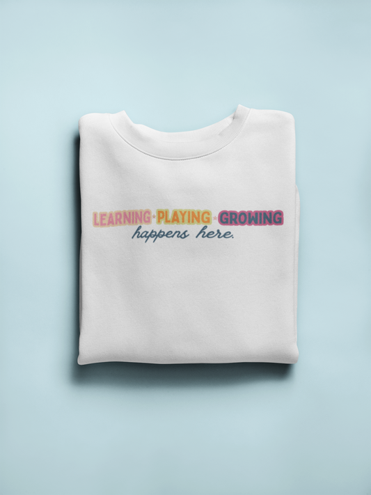learning playing growing crewneck